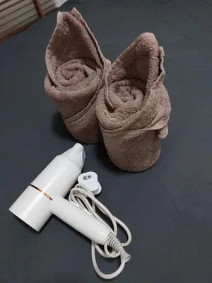 a rolled up towel next to a thermometer and a roll ofimeter at TuR15 PisaStadium 9pax 4rooms PrivateHouse in Bayan Lepas