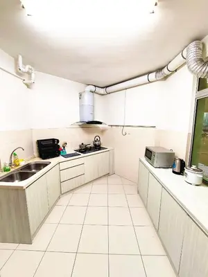 a kitchen with white cabinets and a sink and a window at TuR15 PisaStadium 9pax 4rooms PrivateHouse in Bayan Lepas