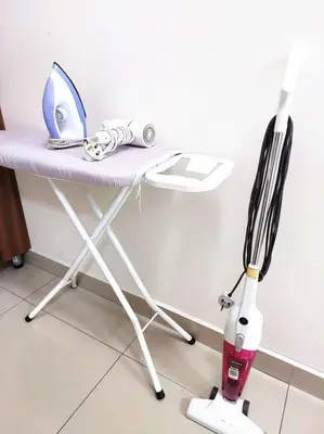 a white table with a fork and spatula on it at TuR15 PisaStadium 9pax 4rooms PrivateHouse in Bayan Lepas