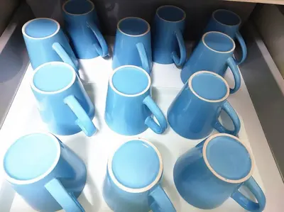 a group of blue cups sitting on a table at TuR15 PisaStadium 9pax 4rooms PrivateHouse in Bayan Lepas