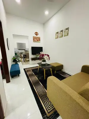 a living room with a couch and a table at Tok Mak Homestay Bukit Mertajam in Kubang Semang