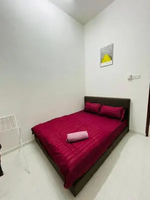 a large red bed in a white room at Tok Mak Homestay Bukit Mertajam in Kubang Semang