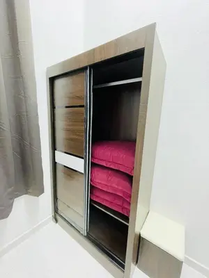 a small closet with a red blanket in it at Tok Mak Homestay Bukit Mertajam in Kubang Semang
