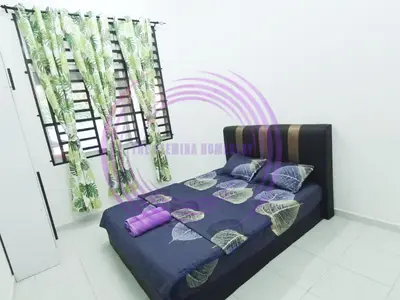 a bedroom with a bed with a rainbow in the background at The Clemira Homestay @ Sungai Karangan, Kulim, Kedah in Padang Serai