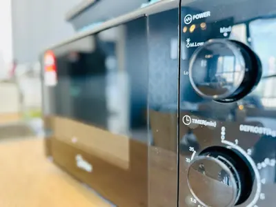 a close up of a toaster oven at Cozy & Drive Urban Suite by WL in Jelutong
