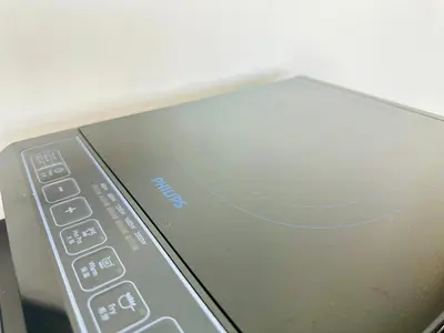 a remote control sitting on top of a cell phone at Cozy & Drive Urban Suite by WL in Jelutong