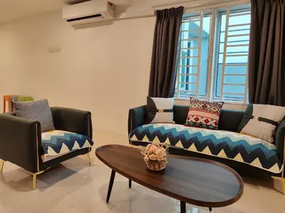 a living room with a couch and a table at Golden 78 Ipoh Homestay in Ipoh