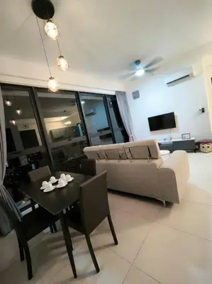 a living room with a couch and a table at Urban Suites, Best Seaview and Cityview in Town in Jelutong