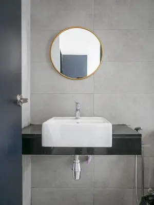 a bathroom with a white sink and a mirror at Urban Suite by Uptrend Home Management in Jelutong