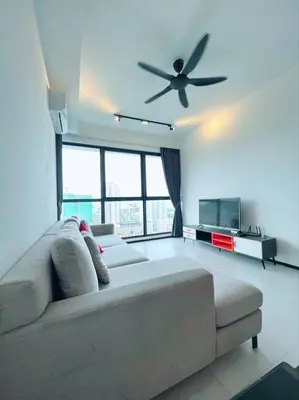 a living room with a couch and a ceiling fan at Urban Suite by Uptrend Home Management in Jelutong