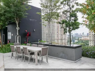 a table and chairs with a view of a city at Urban Suite by Uptrend Home Management in Jelutong