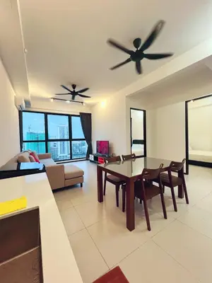 a living room with two ceiling fans and a table at Urban Suite by Uptrend Home Management in Jelutong