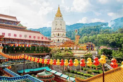 a large building with a pagoda in the background at Cheerful 6BR Town House @ Geortown for 5-14pax by Cohans in George Town