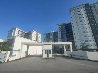 a gas station in front of some tall buildings at EasyStay Kampar (near UTAR) 5bedrooms 10pax Free WiFi in Kampar