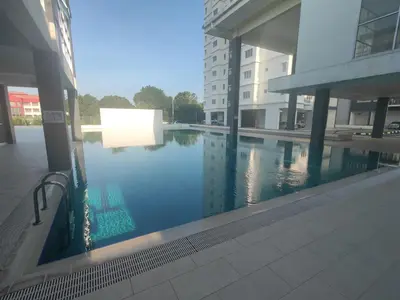 a swimming pool in the middle of a building at EasyStay Kampar (near UTAR) 5bedrooms 10pax Free WiFi in Kampar