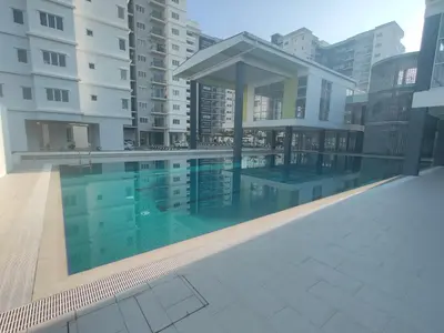 a swimming pool in the middle of a building at EasyStay Kampar (near UTAR) 5bedrooms 10pax Free WiFi in Kampar