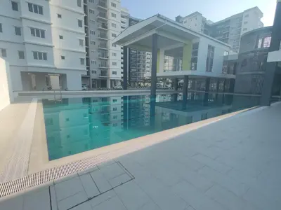 a swimming pool in the middle of a building at EasyStay Kampar (near UTAR) 5bedrooms 10pax Free WiFi in Kampar