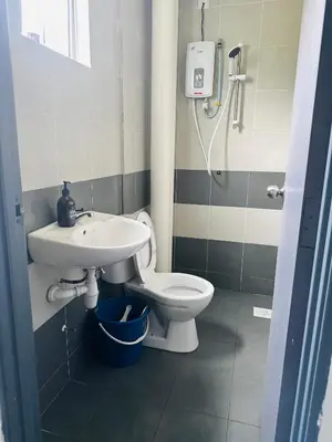 a bathroom with a sink and a toilet at Adamhawa Homestay Emerald Avenue Brinchang in Brinchang