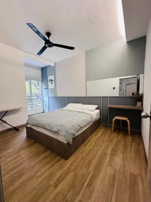 a bedroom with a bed and a ceiling fan at Adamhawa Homestay Emerald Avenue Brinchang in Brinchang