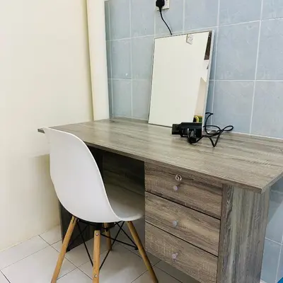 a desk with a white chair and a mirror at CYC homestay 48 Bercham in Kampong Batu Lapan