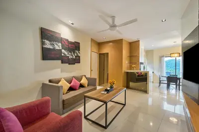 a living room with a couch and a table at SGI Vacation Club Villa @ Damai Laut Holiday Resort in Lumut