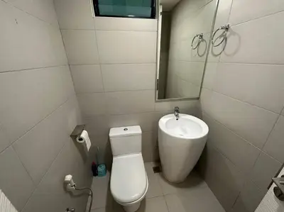 a small bathroom with a toilet and a sink at JazzA 2R3B Suite Strait Quay Near Stonyhurst School by Homey Planet in Tanjong Tokong