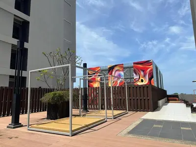 a fence with a mural on the side of a building at JazzA 2R3B Suite Strait Quay Near Stonyhurst School by Homey Planet in Tanjong Tokong