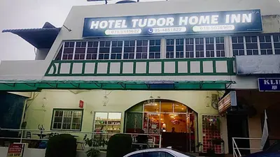 a hotel tudor home inn with a sign on it at Hotel Tudor Home Inn Cameron Highlands in Brinchang