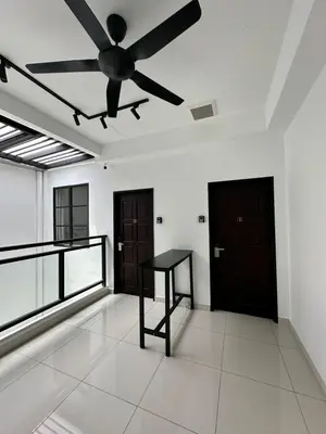 a living room with a ceiling fan and a table at Lodge 43 House in George Town