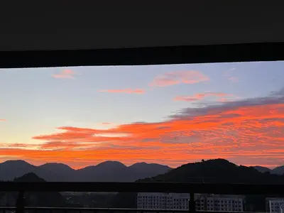 a view of a sunset from a balcony at BlissFul Homestay_Horizon@IPOH in Ipoh