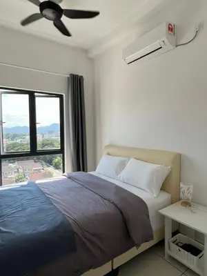 a bedroom with a bed with a ceiling fan and a window at BlissFul Homestay_Horizon@IPOH in Ipoh