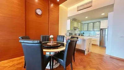 a kitchen and dining room with a table and chairs at Straits Quay Highest & Wonderful Seaview Suite in Tanjong Tokong