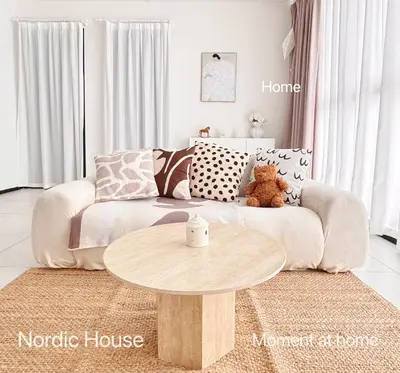 a living room with a couch and a coffee table at Georgetown Seaview & Cityview Childroom Infinity pool with Carpark in Jelutong