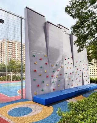 a climbing gym with a climbing wall in a pool at Georgetown Seaview & Cityview Childroom Infinity pool with Carpark in Jelutong