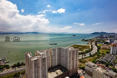 an aerial view of a large body of water with buildings at Urban Suites with Spectacular High Floor View #3BR #03 in Jelutong