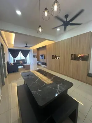 a living room with a table and a ceiling fan at Ulike~Homestay~C~3Room-The Venus in Sitiawan