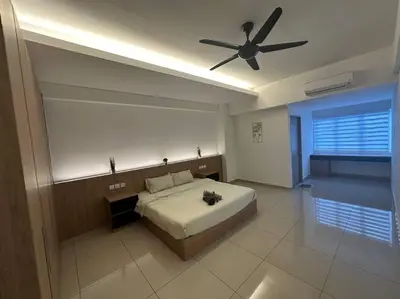 a bedroom with a bed and a ceiling fan at Ulike~Homestay~C~3Room-The Venus in Sitiawan