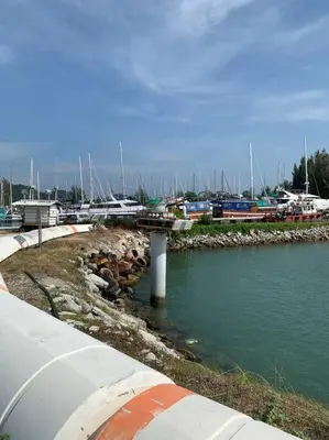 a marina with boats in the water and a bridge at Ulike~Homestay~C~3Room-The Venus in Sitiawan