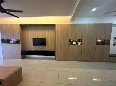 a room with a tv on a wall at Ulike~Homestay~C~3Room-The Venus in Sitiawan