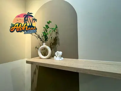 a counter with a vase and a plant on it at Urban Suites Stylish 3BR in Georgetown with Stunning Seaview in Jelutong