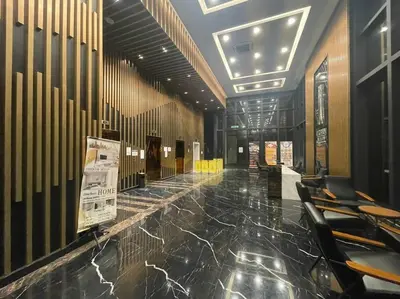 a lobby with a row of chairs in a building at Urban Suites Stylish 3BR in Georgetown with Stunning Seaview in Jelutong