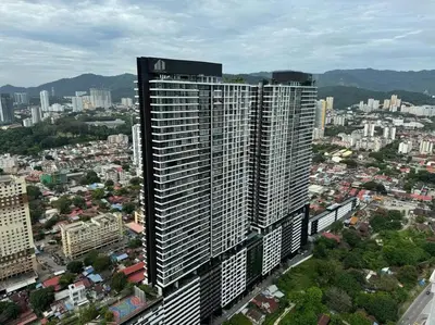 an aerial view of a city with tall buildings at Urban Suites Stylish 3BR in Georgetown with Stunning Seaview in Jelutong
