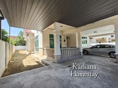 a house with a car parked in the driveway at Modern Classy Karliana Homestay Penang in Kepala Batas