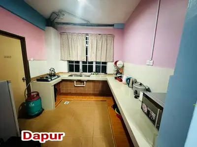 a kitchen with pink and white walls and a sink at Zurie Muslim Homestay in Brinchang