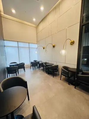a row of tables and chairs in a waiting room at Urban Suites R l 6pax 2R2B l SeaView &CityView l Georgetown in Jelutong