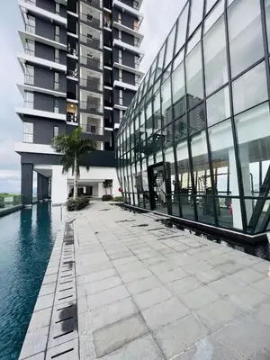 an external view of a building with a pool of water at Urban Suites R l 6pax 2R2B l SeaView &CityView l Georgetown in Jelutong