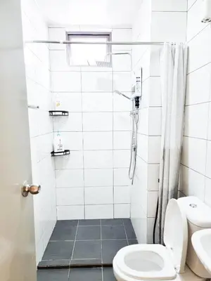a white bathroom with a shower and a toilet at Mossy Forest Family Retreat II, 2-8 pax, Cameron Highlands in Cameron Highlands
