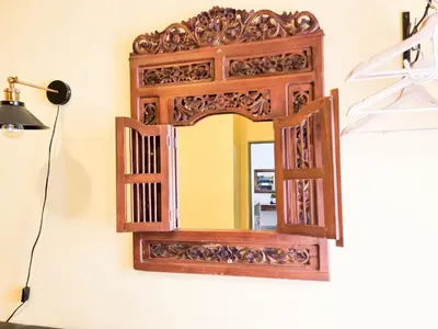 a mirror hanging on a wall in a room at Mossy Forest Family Retreat II, 2-8 pax, Cameron Highlands in Cameron Highlands