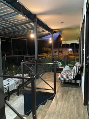 a screened in porch with a zebra chair on a patio at Rods Homestay - Kg Agong Penaga in Kepala Batas