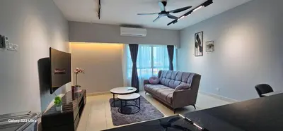 a living room with a couch and a table at IPOH Town R&E Homestay in Ipoh